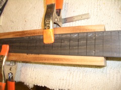 Fitting fretboard to neck