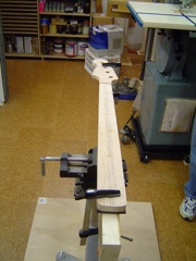 Putting neck in jig for shaping