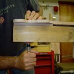 Putting neck in jig for shaping