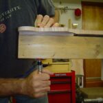 Putting neck in jig for shaping