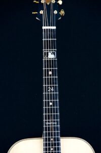 The highly personalized fretboard. Jerry's number in the major leagues is 24.