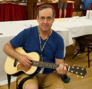 Dave Rockett and his beautiful travel guitar.